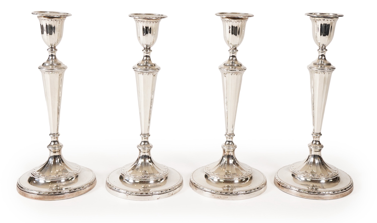 A set of four George III silver candlesticks, by John Green, Roberts, Mosley & Co